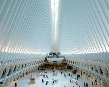 Modern architectural view of the Oculus in NYC, showcasing its futuristic design and bustling interior.